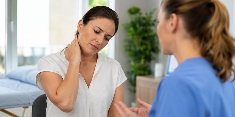Patient-discussing-neck-pain-and-headaches-with-a-wellness-provider-in-Glenelg-MD Patient discussing neck pain and headaches with a wellness provider in Glenelg MD