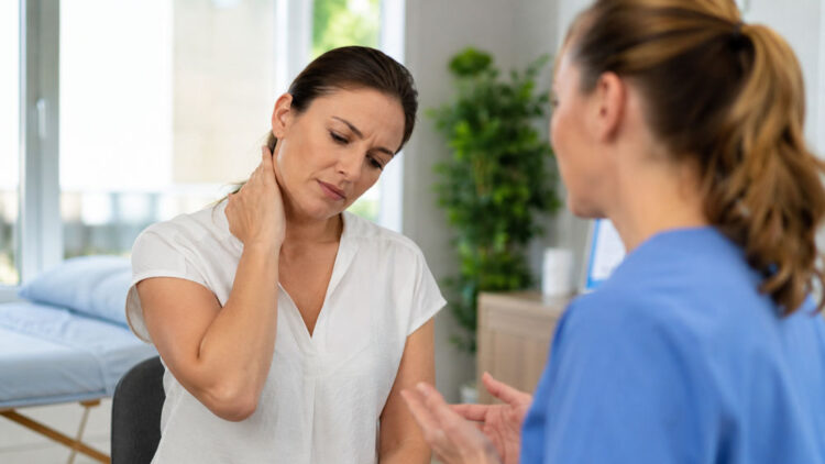 Patient-discussing-neck-pain-and-headaches-with-a-wellness-provider-in-Glenelg-MD Patient discussing neck pain and headaches with a wellness provider in Glenelg MD