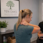 Patient discussing recurring muscle tightness with a wellness provider in Glenelg MD